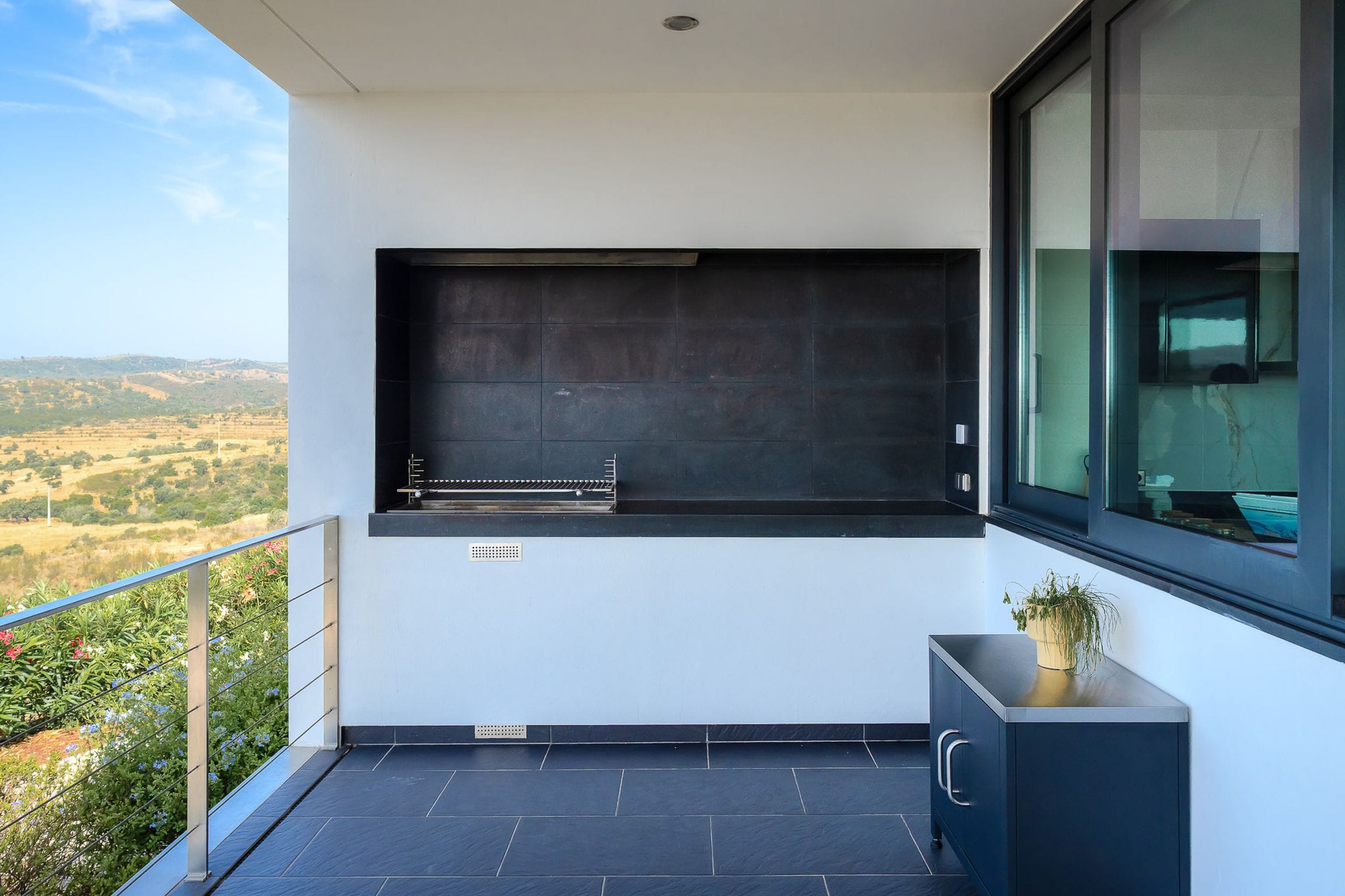 Built-in barbecue on the covered terrace with countryside views
